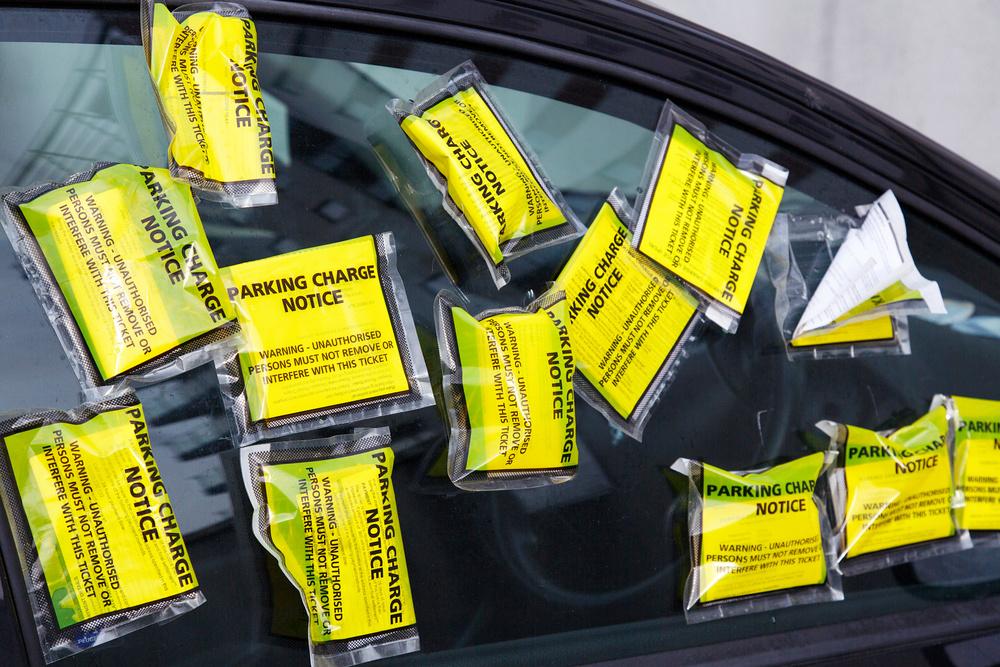 Parking notices all over a car