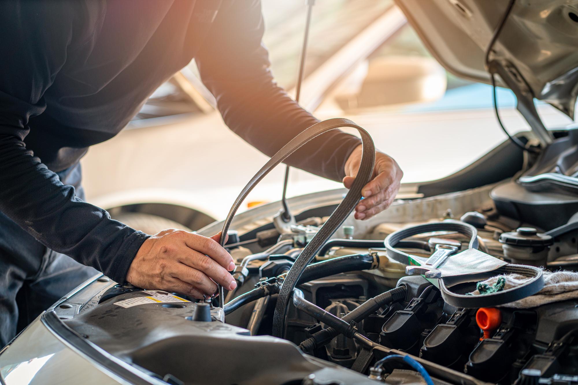 Mechanic repairs a car