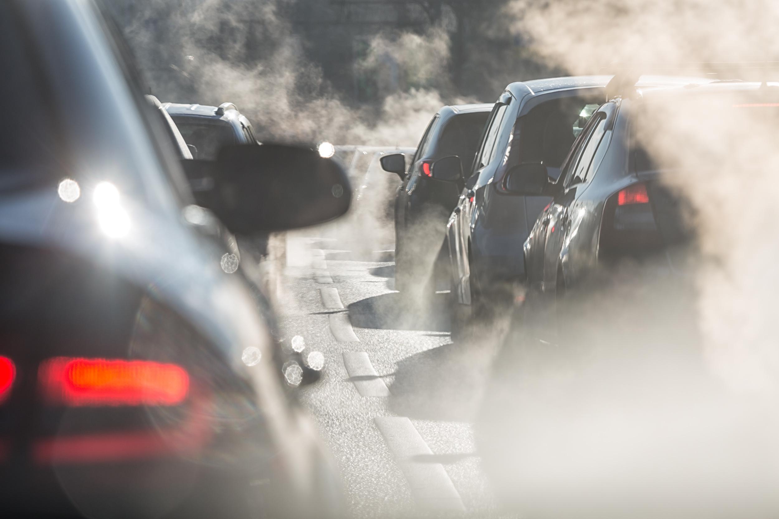 Smoke from exhaust of multiple cars