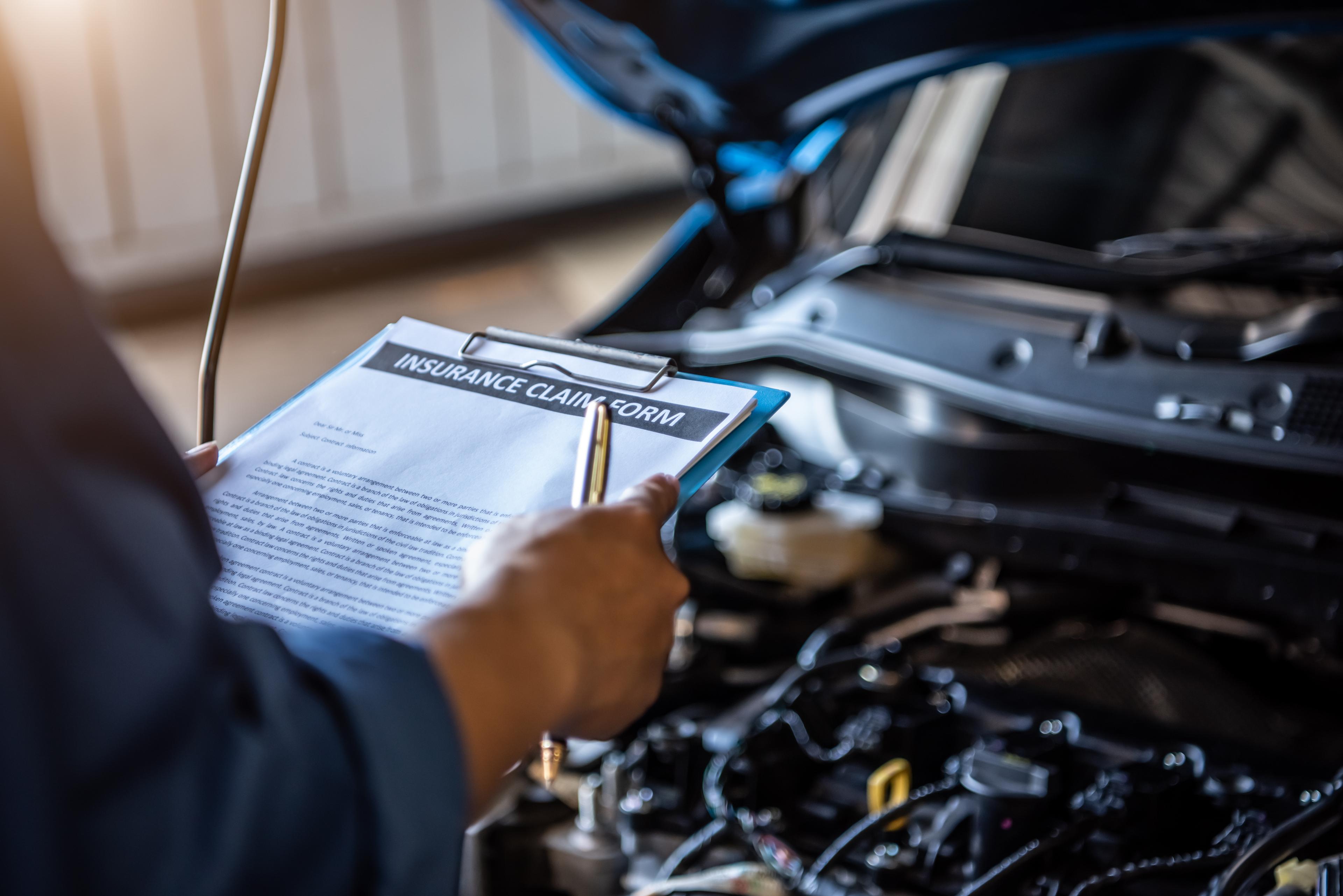 Inspecting the engine of a car