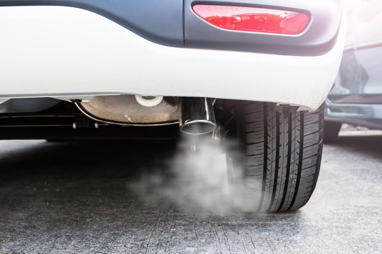 white smoke out of an exhaust pipe