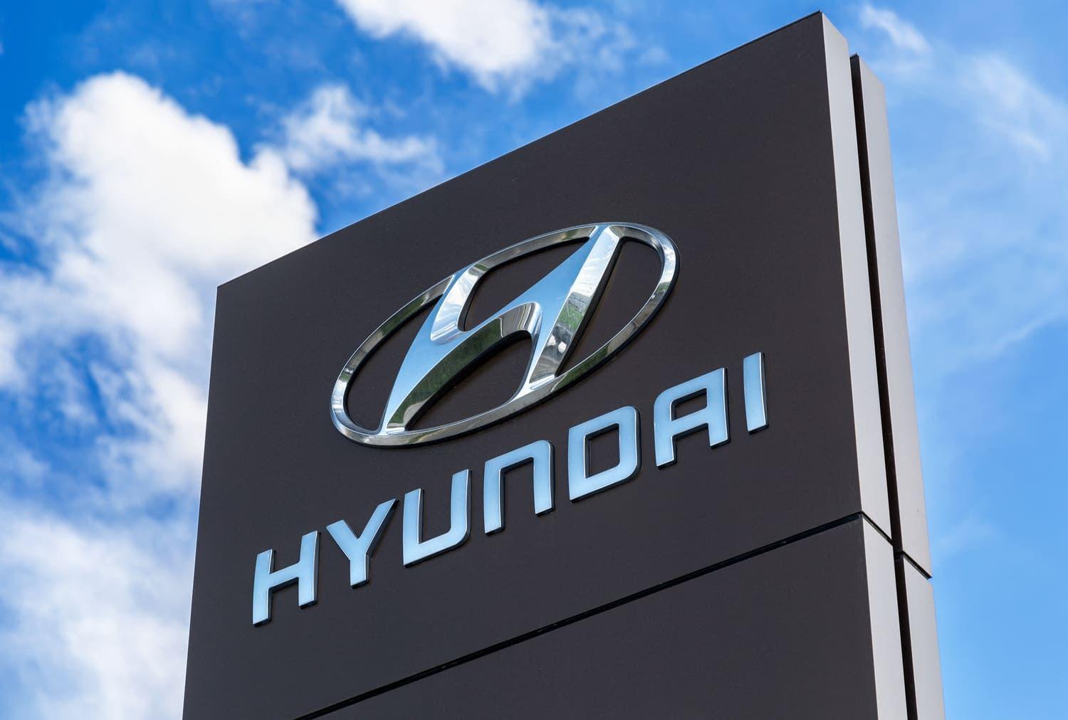 Hyundai sign against a blue sky