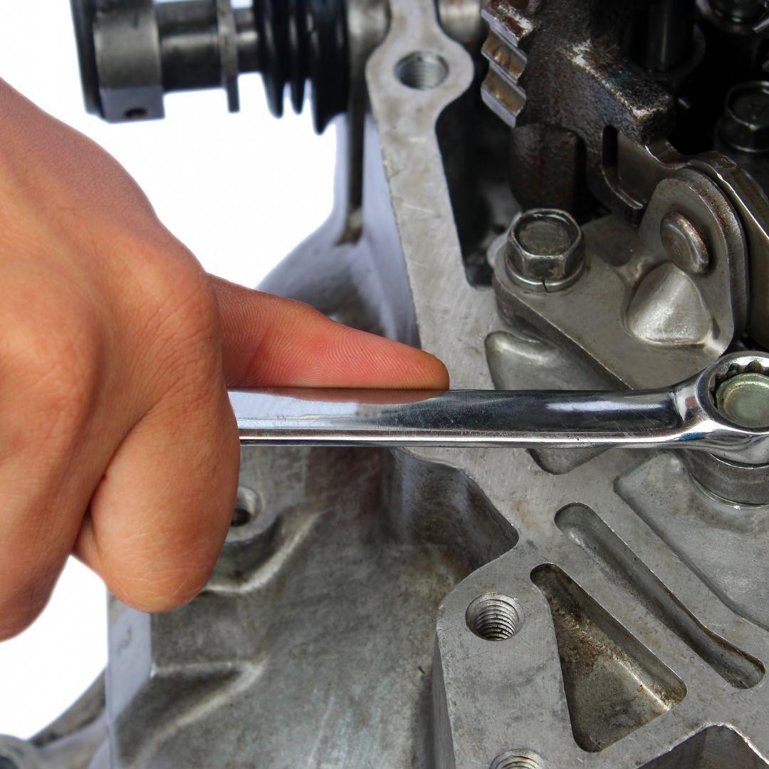 mechanic changing gearbox 