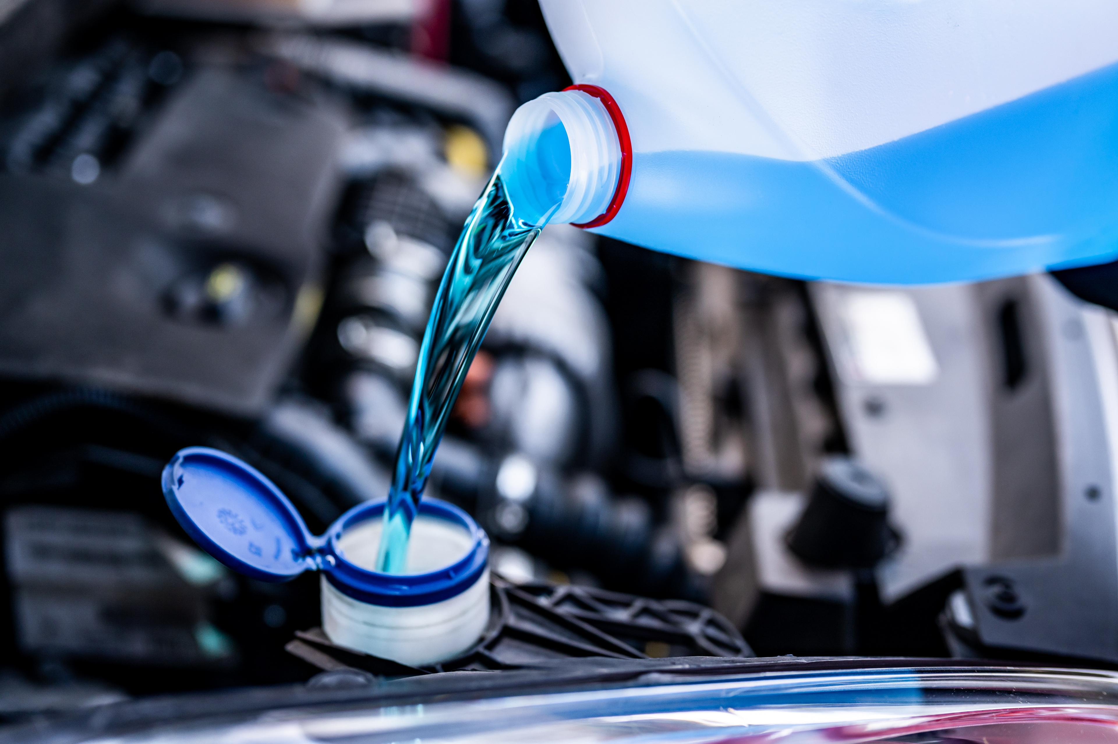 Car coolant poured into the coolant reservoir