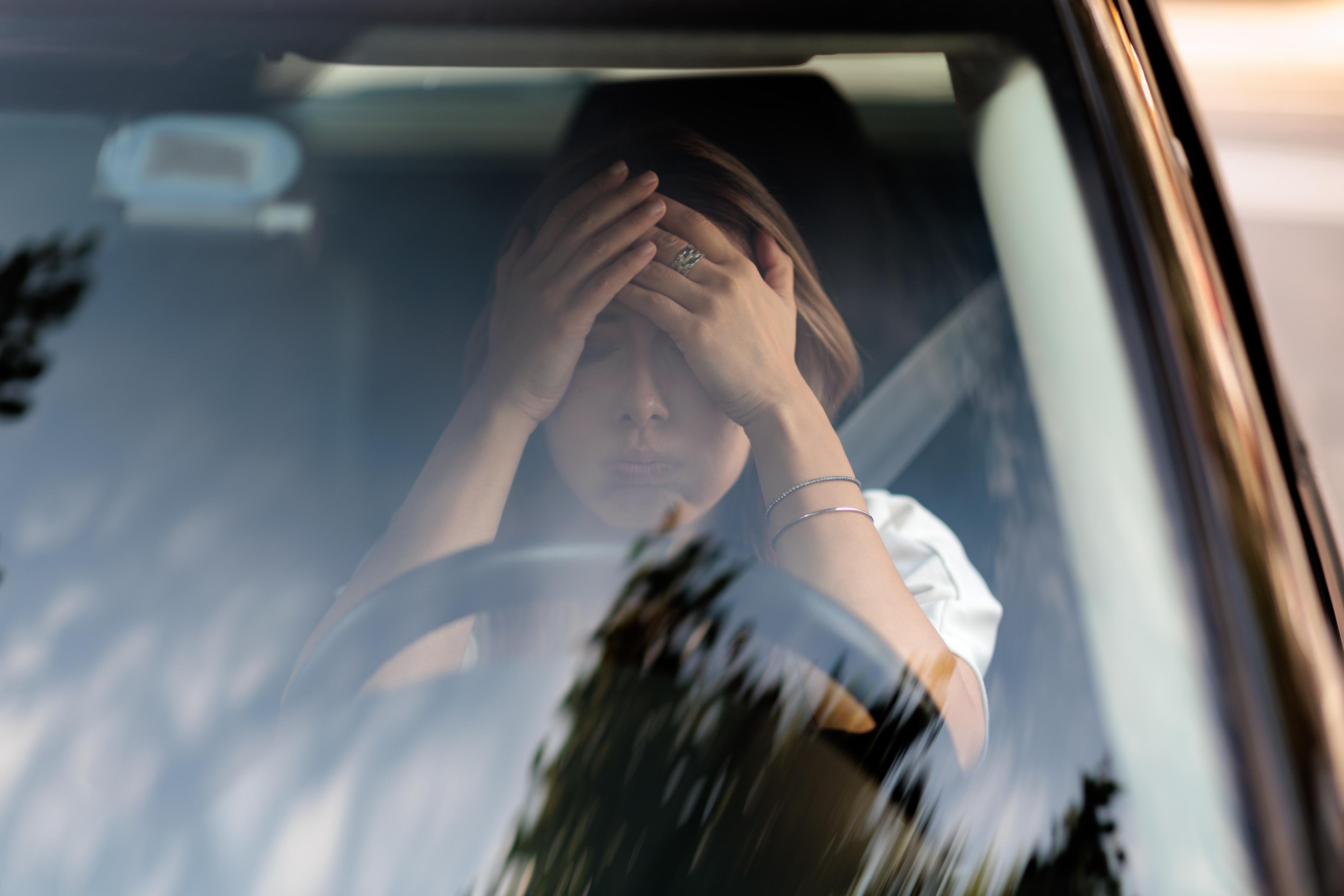 Woman in car breakdown