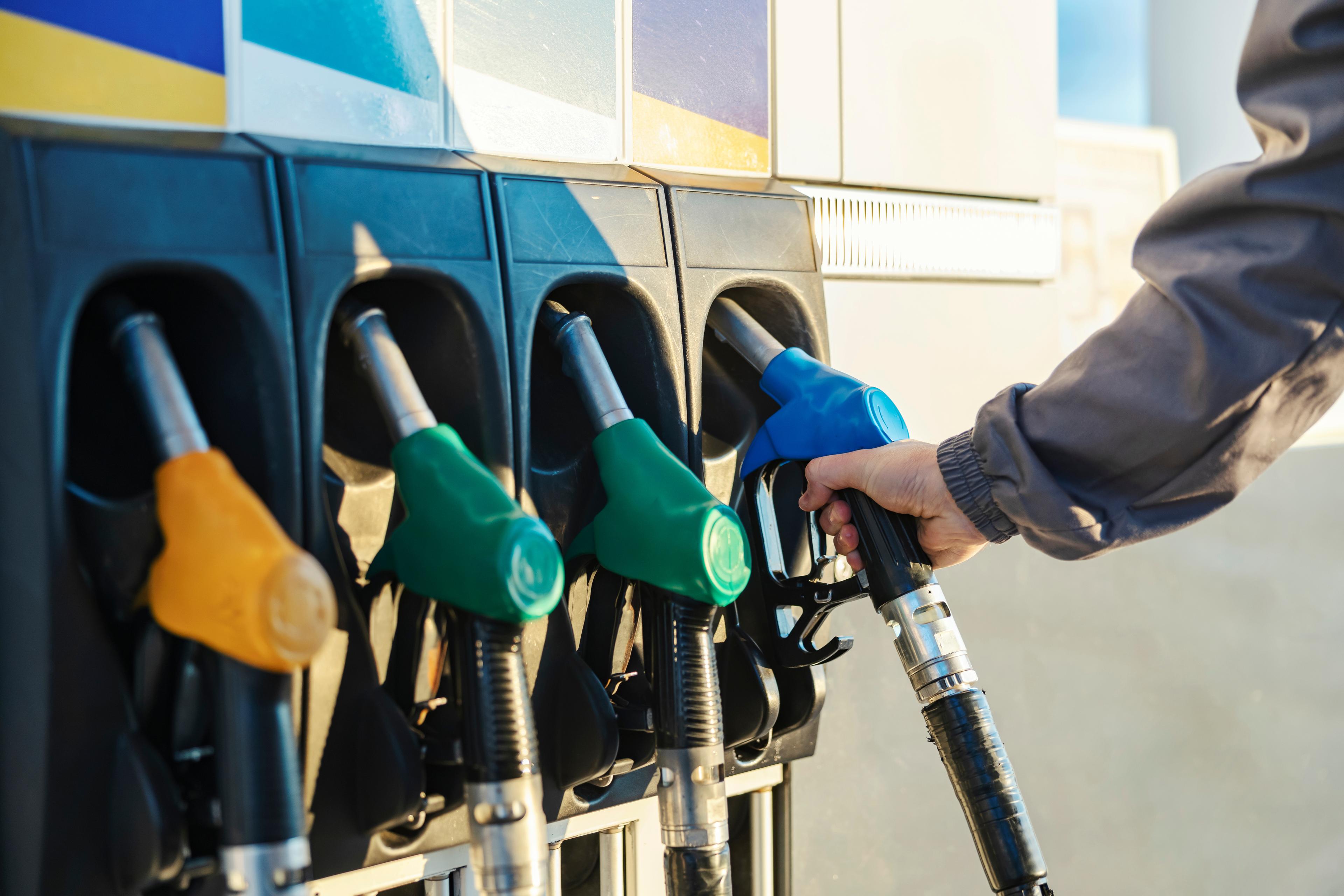 Hand reaches for fuel pump