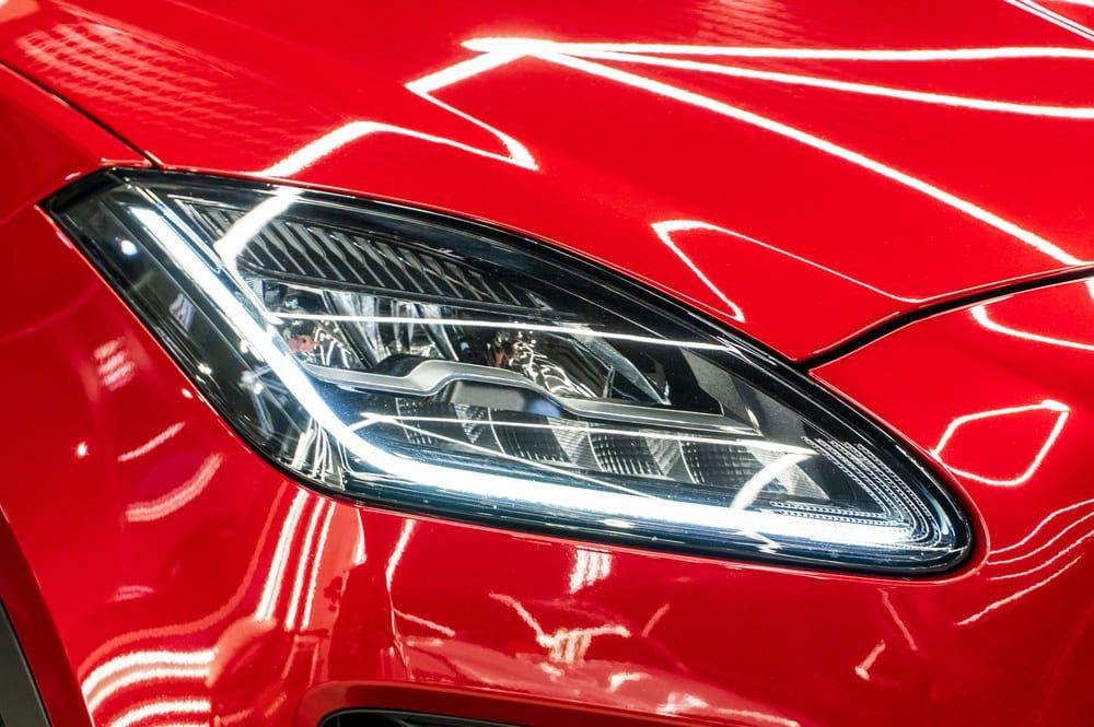 Close up of a red car headlights