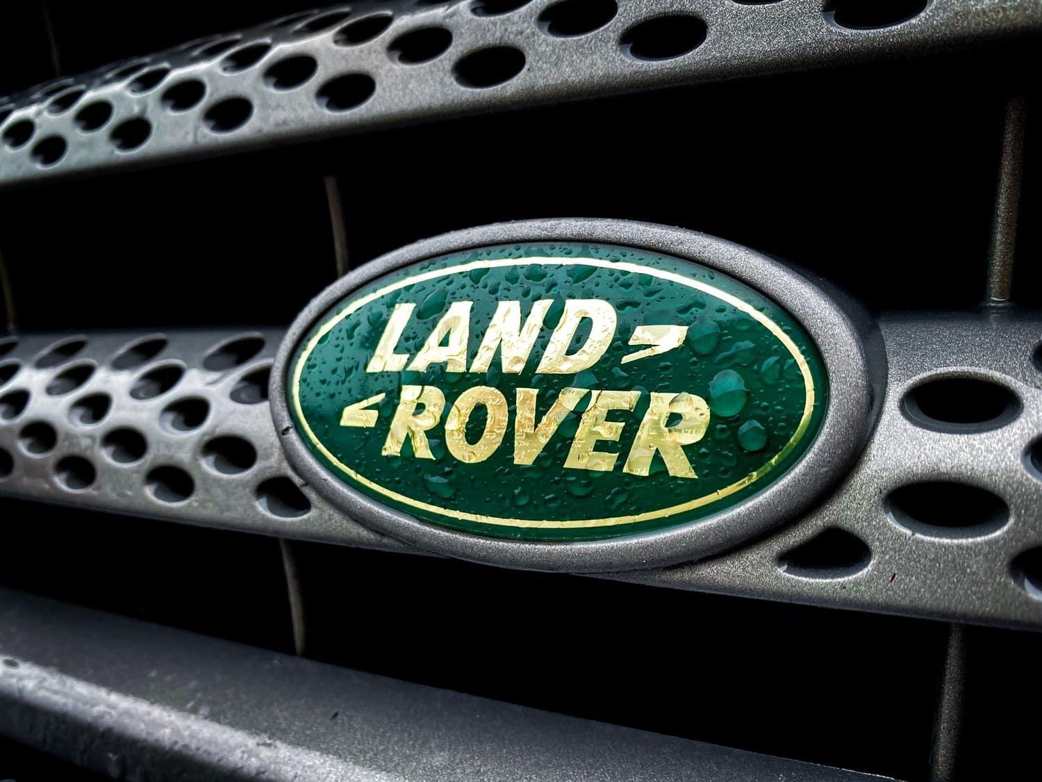 Land Rover Range Rover Badge on Luxury SUV Front Grille in Rain