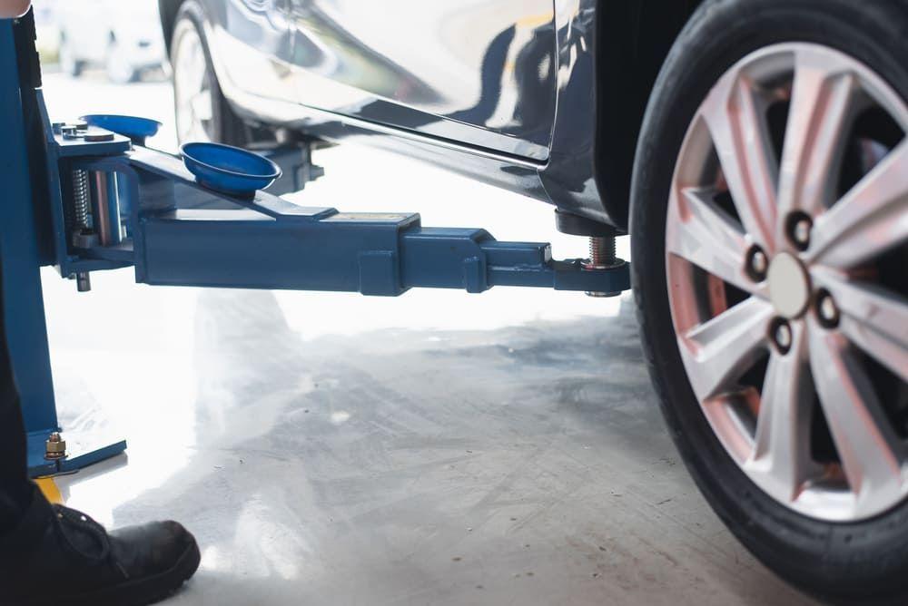 Machinery fitted to a car for repair
