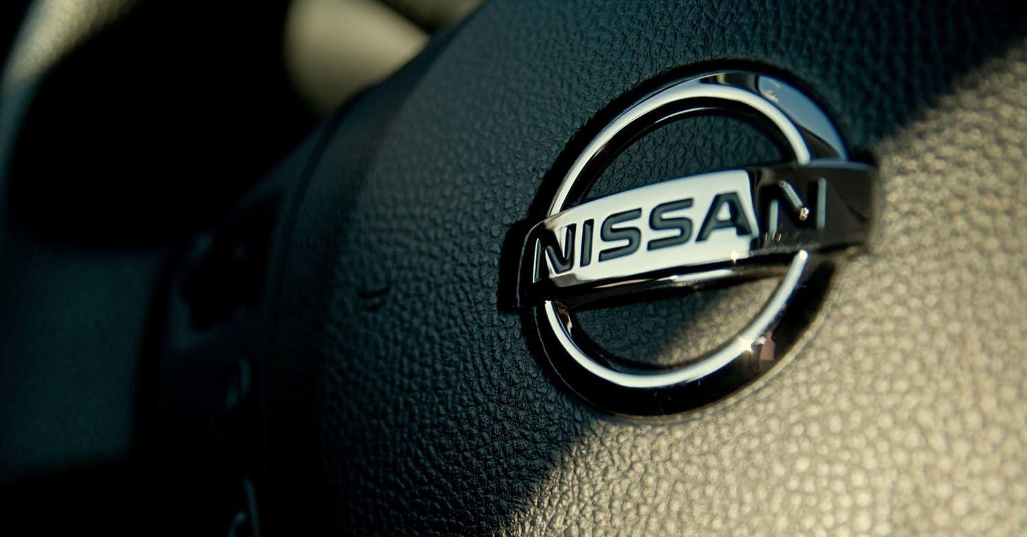 Nissan badge on a steering wheel
