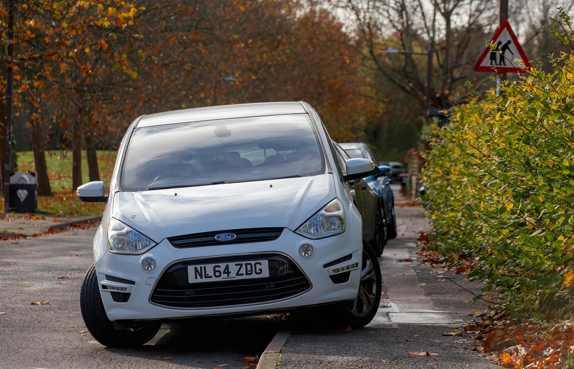 A car parked on the pavement