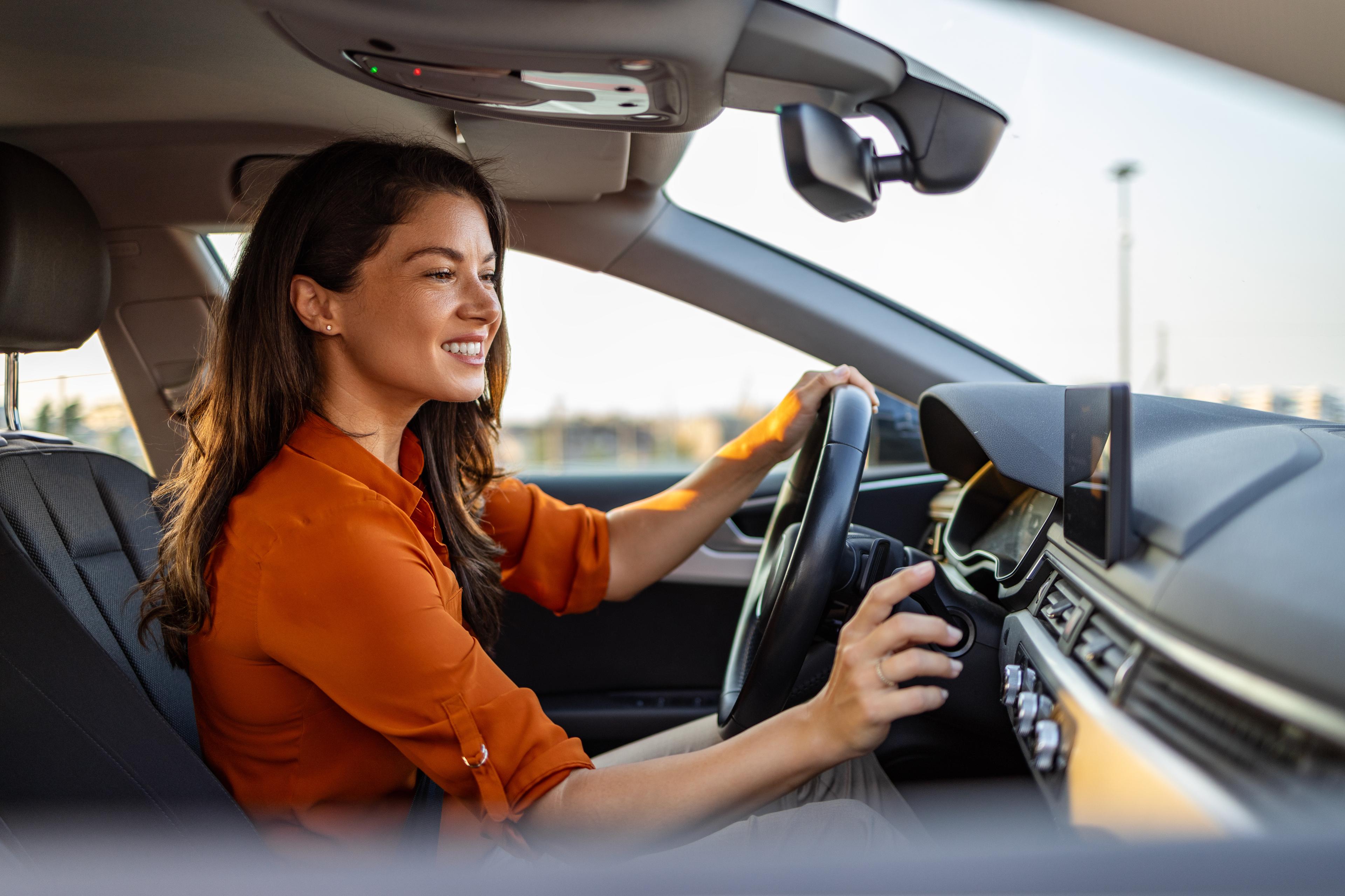 Women turns on car air con